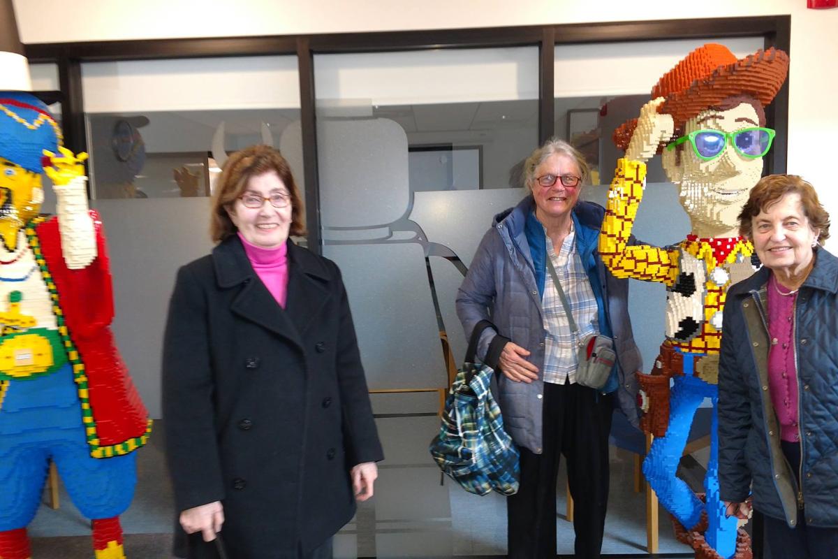 Seniors Pose with Lifesize Lego Statues