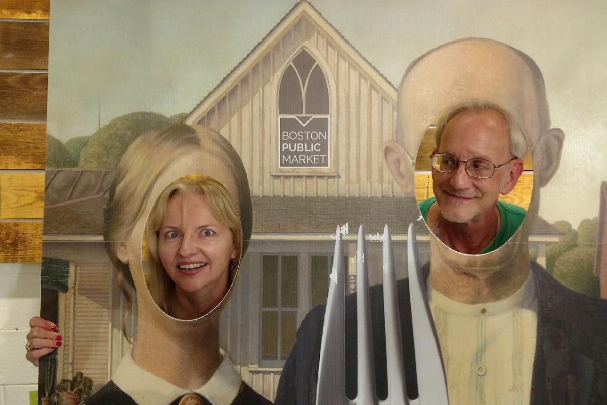 A Woman and Man Pose as Farmers in the American Gothic Painting