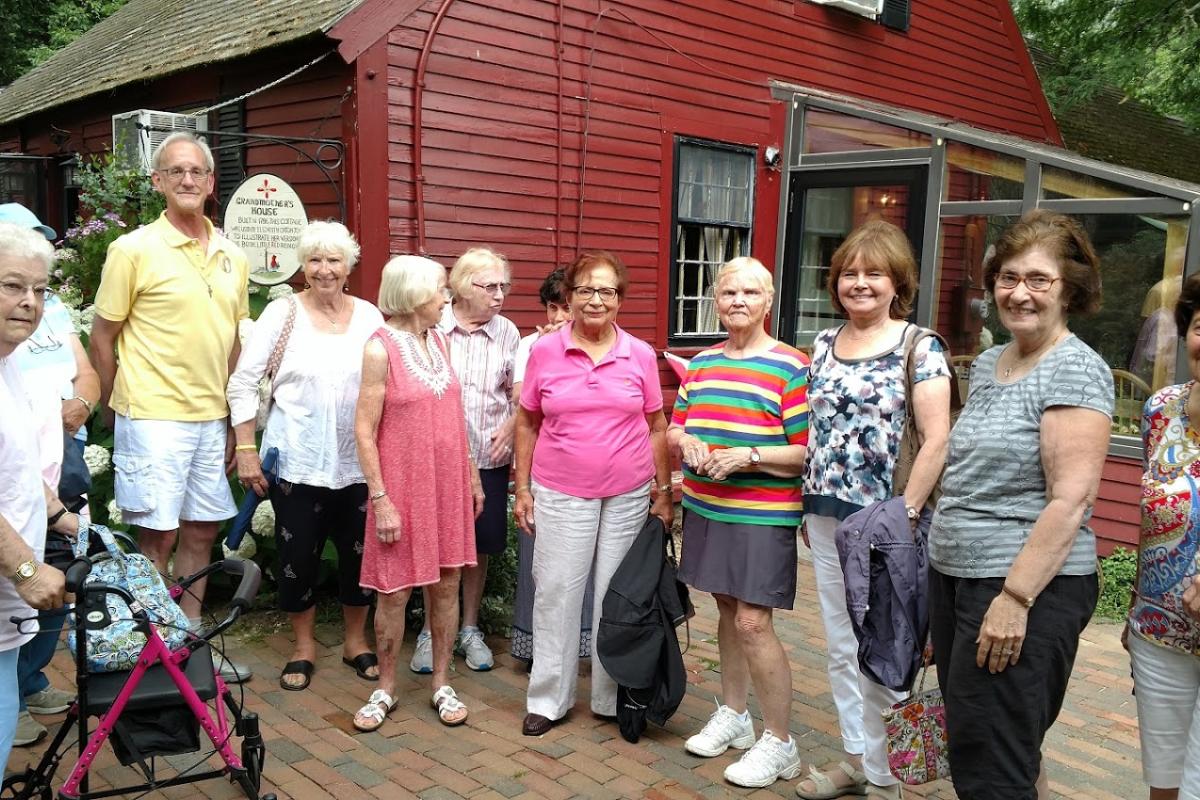 Guests Pose in Front of Grandmother's House at Pickity Place before Lunch