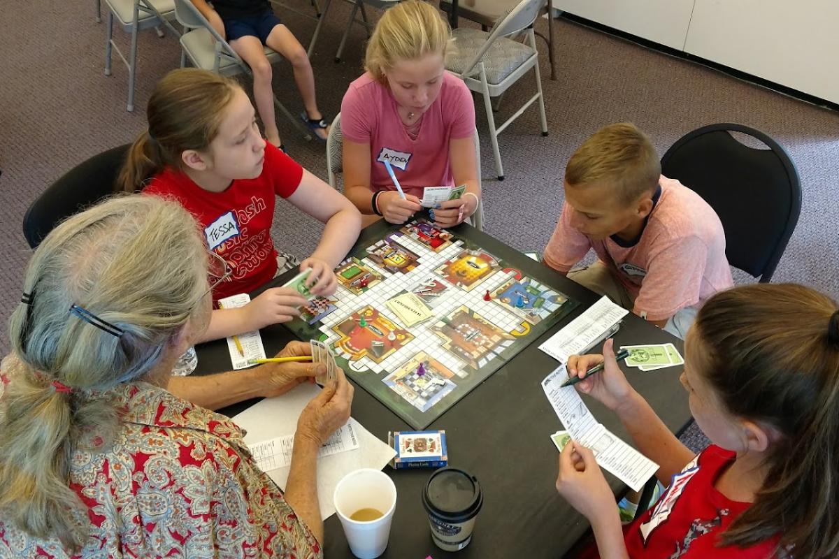 Generations Play "Clue" during our First Intergenerational Game Day