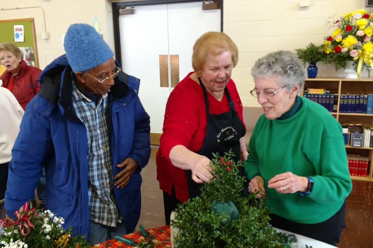 Gloria and Bizzy Get Advice from a Member of the New Meadows Garden Club that Hosted the Annual Boxwood Tree Workshop
