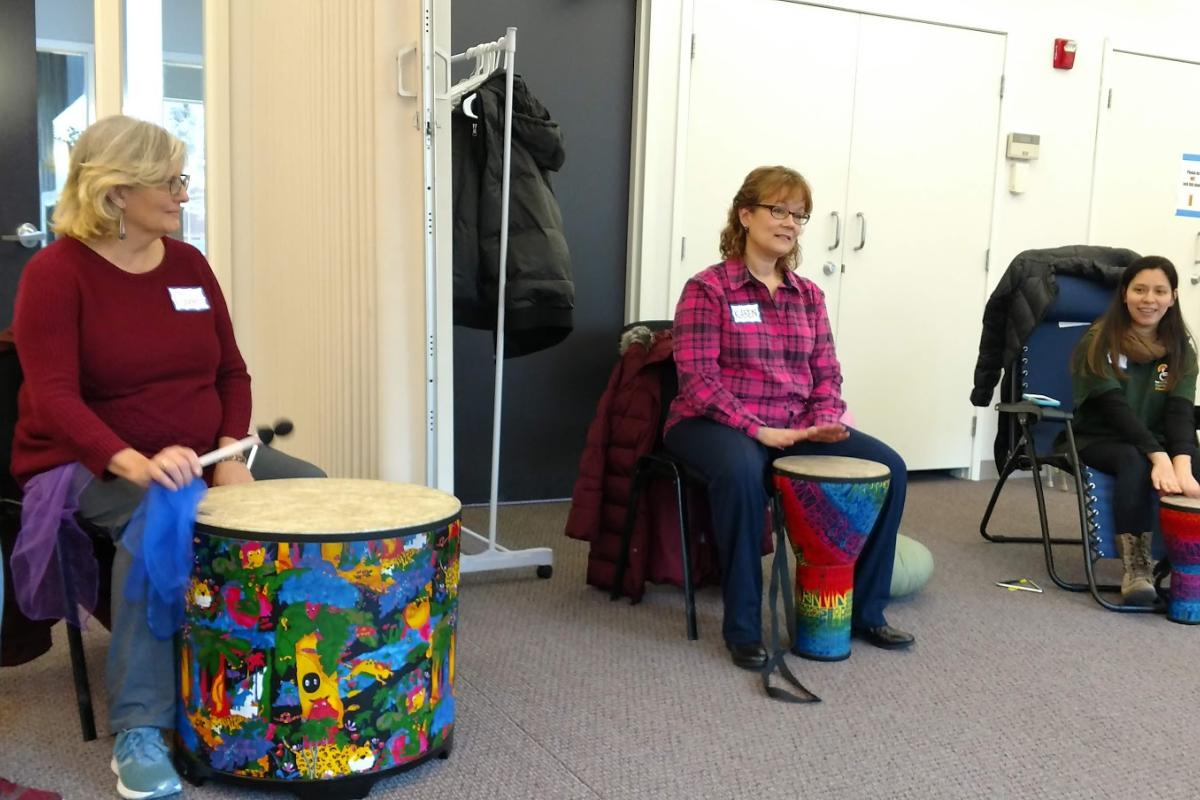 Volunteers Keep the Beat in the Drum Circle at the December Indoor Memory Cafe