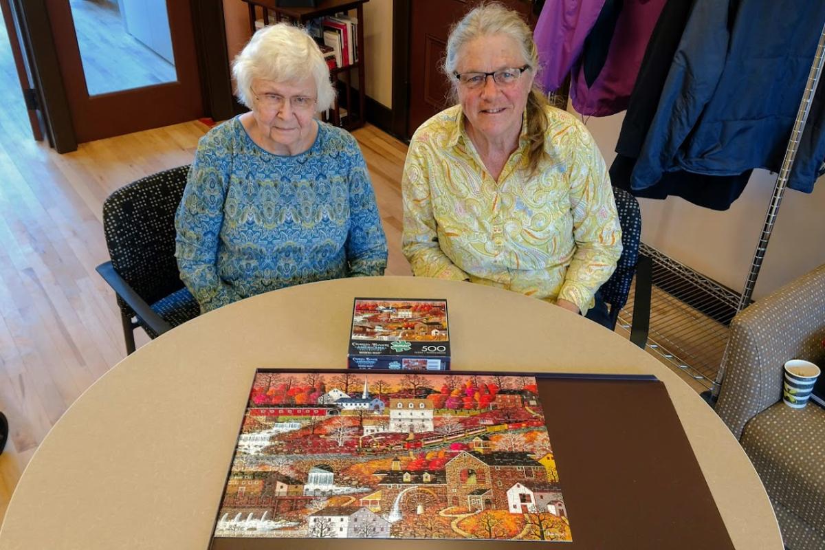 Martha and Bonnie Completed the First Puzzle in the Topsfield COA's New Home