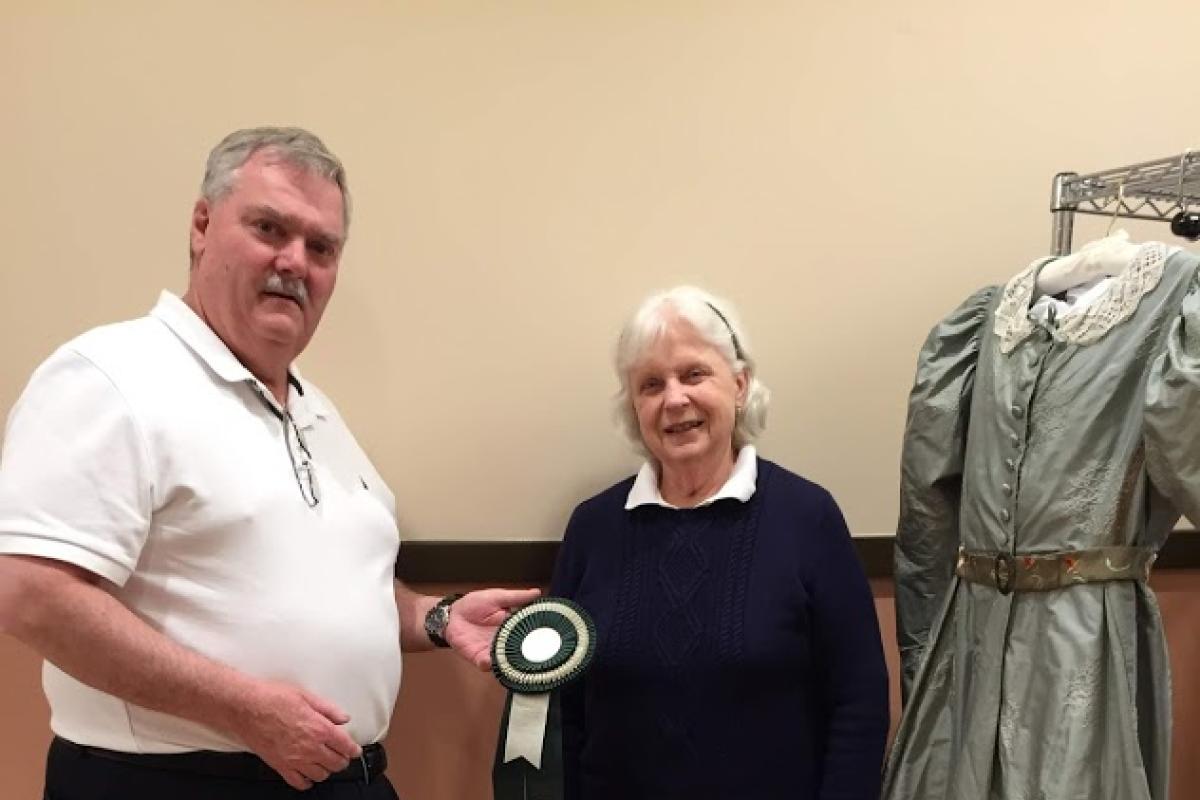 Jim Presents Special Award to Annette for Historical Gown