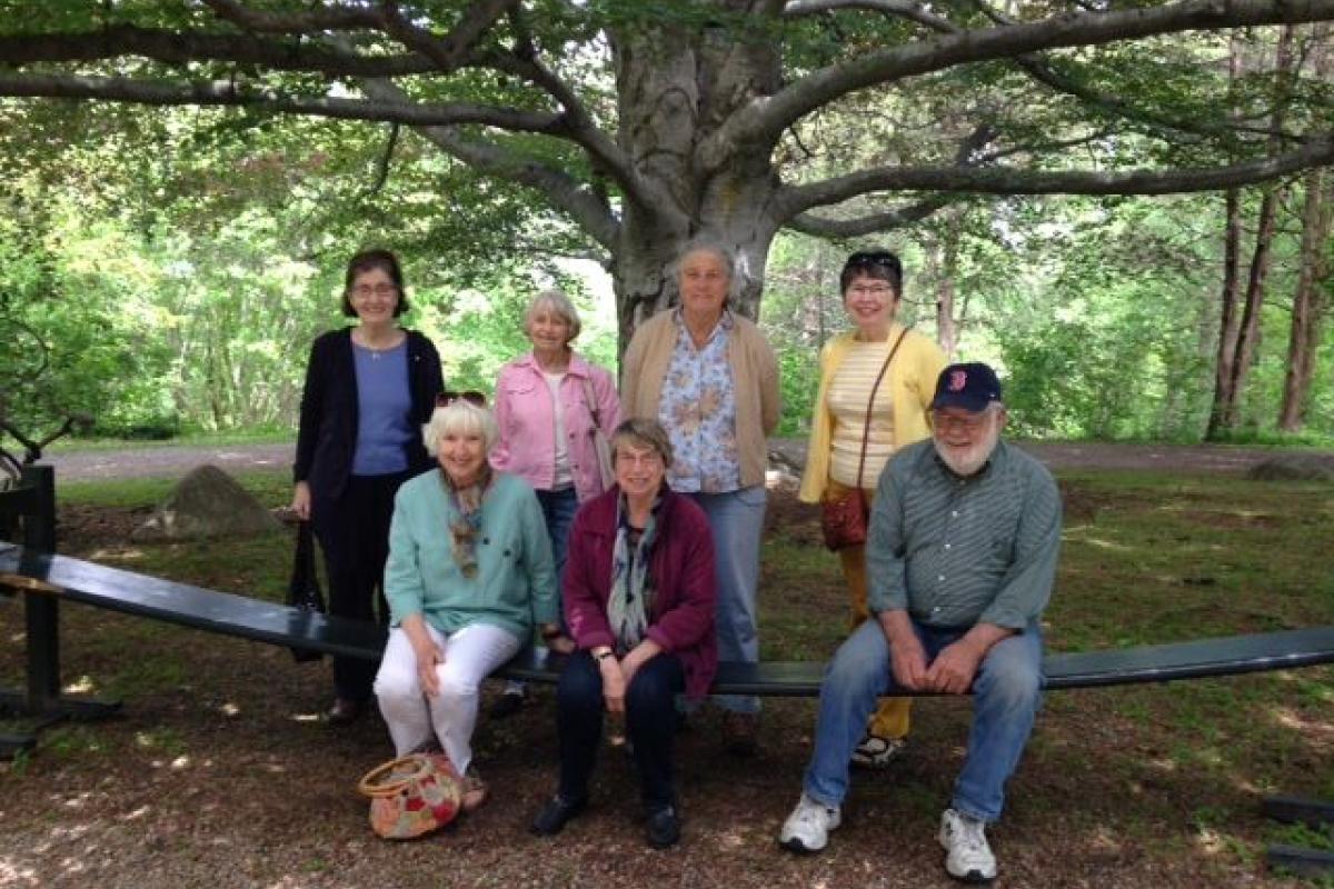 The Group Who Traveled to Long Hill Estate Pose on the Flexible Bench