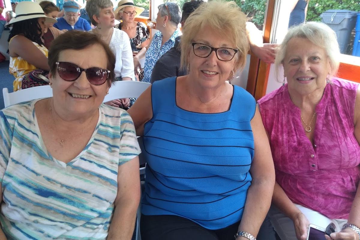 Three Friends Enjoying a Day on the Water on a Charles River Cruise