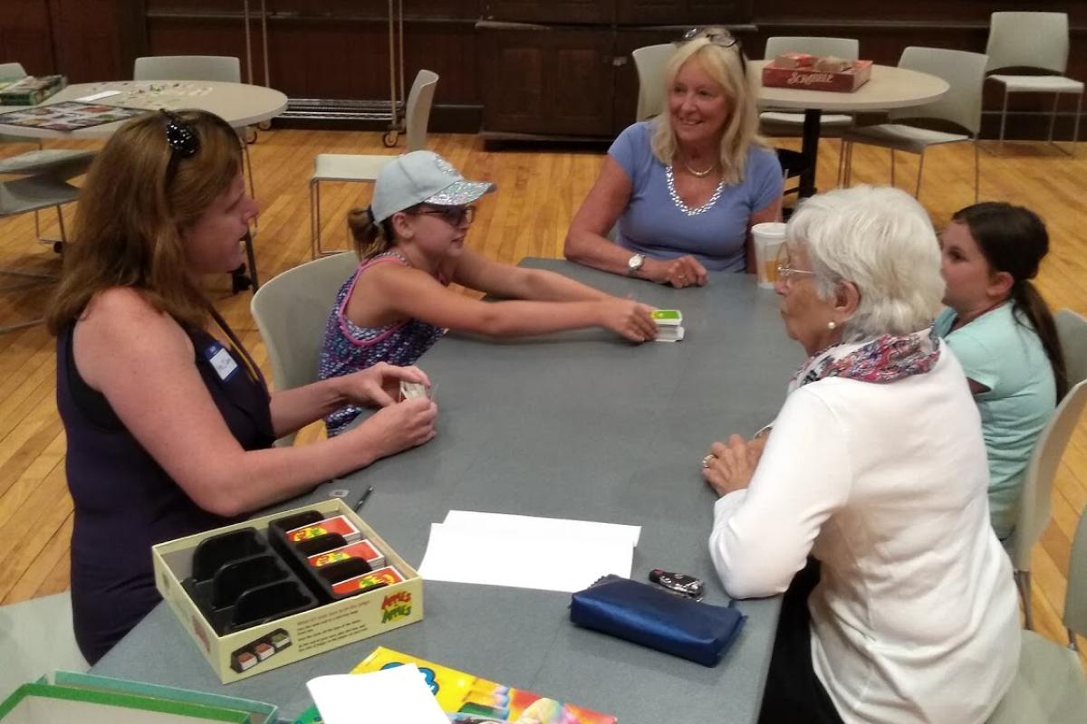 Participants of All Ages Play Board Games during Intergenerational Game Day