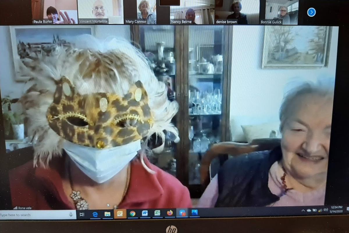 Woman dons masks in Zoom meeting