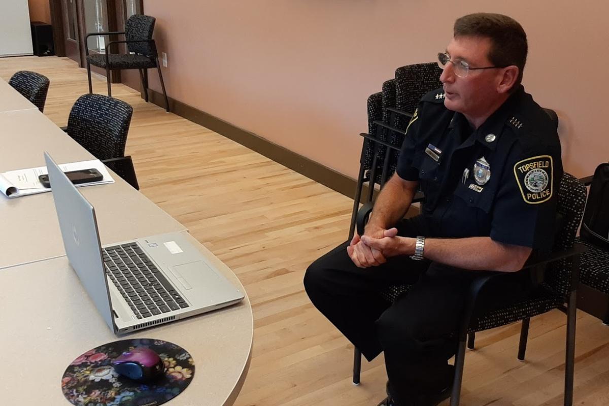 Police Officer participates in Zoom meeting